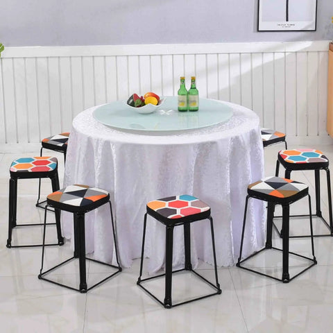 Dining table with Rotating Tabletop Serving Tray With Lazy Susan Turntable For Dining Tables, surrounded by colorful stools.