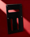 Durable PVC Electric Guitar Rear Panel Cover Plate with secure fit backplate for electronics on red background