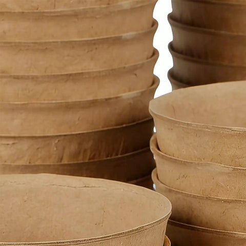 Close-up of stacked breathable germination pots for seedlings paper pulp nursery pots with drainage for yard garden