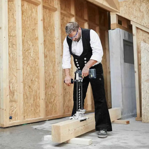 Heavy Duty Brushless Cordless Drill And Driver With Unbreakable Gears And 18 Volt Battery used by contractor on wood beam.