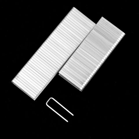 Kickass Shutter Repair Kit With Hella Durable Staples For Plantation Window Louvers Replacement Pins 0.6 X 0.2 Inch staples and pin laid out.