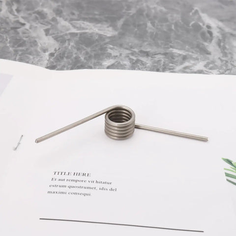 304 stainless steel torsion spring, part of Beefy Torsion Springs Set For Fireplaces With Sliding Doors, 4 Pack, 15mm OD, 2mm wire.