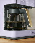 Total Game Changer Multi Brew Coffee Maker 12 Cup Glass Carafe with brewed coffee and stylish lavender finish.