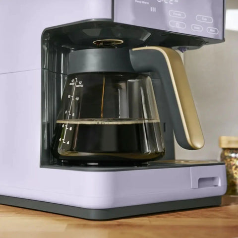 Total Game Changer Multi Brew Coffee Maker 12 Cup Glass Carafe with brewed coffee and stylish lavender finish.