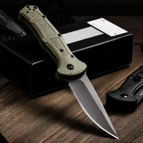 EDC Ready Folding Knife With D2 Steel Blade And Non Slip Fiberglass Handle placed on a dark wooden surface
