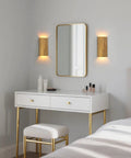 ZEROUNO Modern LED Wall Sconce Indoor Wall Lights Set of 2, Bronze Hardwired Up and Down Wall Mount Light for Living Room Bedroom Hallway Corridor Stairs Warm White 3000K with Replacement G9 Bulbs installed beside a mirror.