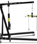 Heavy Duty Hydraulic Engine Hoist Two Ton Folding Shop Crane Telescopic Boom with chains and wheels for easy maneuvering.
