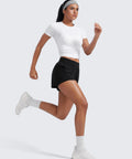 Woman running in Women Running Shorts Double Layer 3 Inch High Rise 2 In 1 Built In Spandex Short With Zip Pockets For Phone Tennis Workout Feathery Fit