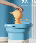 Compact Portable Mini Washing Machine Foldable Washer With Spin Dryer Bucket in blue, washing an orange item. 2.8L capacity shown.