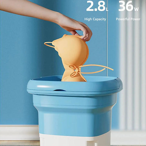 Compact Portable Mini Washing Machine Foldable Washer With Spin Dryer Bucket in blue, washing an orange item. 2.8L capacity shown.