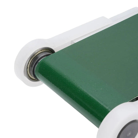 Close-up of Mini Electric Conveyor Belt With Adjustable Speed 0-116 RPM PVC Belt Compact Automation Tool edge and roller