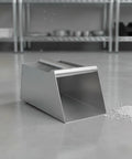 Stainless Steel Dustpan And Grain Scooper Rugged Metal Build With Ergonomic Handle For Easy Debris And Grain Cleanup In Workshops Warehouses Farms And Home XL Heavy Duty Must Have For Tough Messes, stainless steel dustpan shown on floor