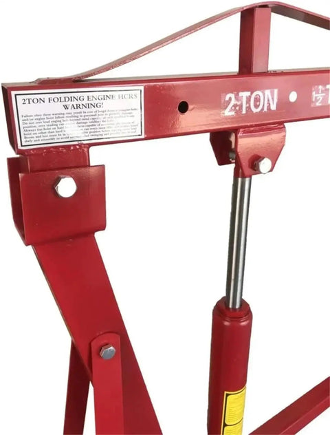 Top Shelf Folding Hydraulic Engine Hoist With Telescopic Boom 2 Ton Capacity Muscle Power Motor Crane close-up of lift mechanism
