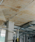 Contractor using Green Beam Line Laser PM 2 LG With Horizontal And Vertical Alignment on a tripod in a construction site