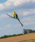 330 S RTF Basic Drone With Safe Technology showcased flying against a clear sky with landscape below