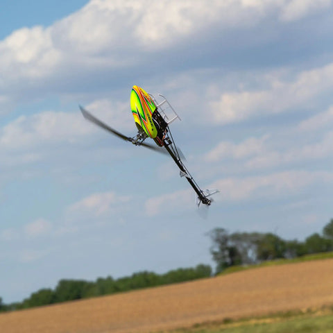 330 S RTF Basic Drone With Safe Technology showcased flying against a clear sky with landscape below