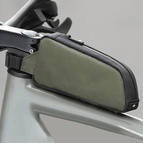 Frame Storage Pouch For Cycling Top Tube Bag And Bikepacking Gear attached to a bike's top tube, green with zippered storage