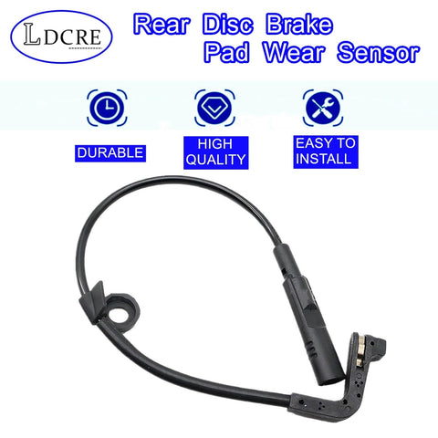 Rear disc brake pad wear sensor cable with black plastic sensor housing and connector, front view.