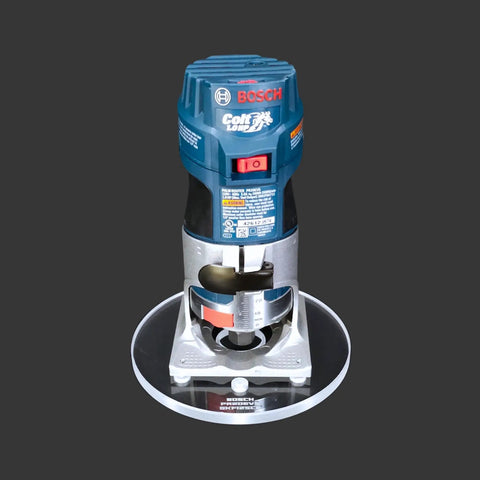 Heavy Duty 6 Inch Round Router Base Plate With Snappy Pre Drilled Holes Clear Acrylic Drop In Ready Fit For Bosch Colt Routers And Template Guides Made In USA Killer Woodworking Tool with Bosch Colt router on top.