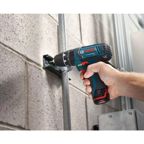 Hand holding 12V Max 3/8 Inch Hammer Drill Driver Bare Tool for Pros drilling into concrete wall, showcasing ultra lightweight power.