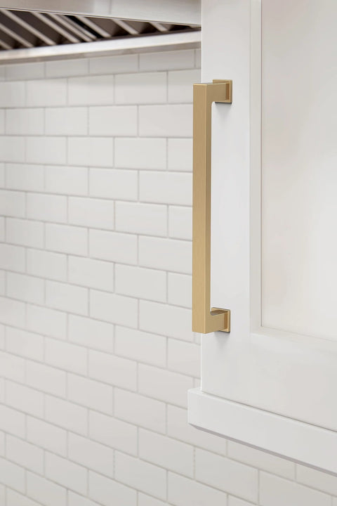 Champagne Bronze Bridgeport Cabinet Pull 6-5/16 Inch Center to Center 7-1/16 Inch Total Length installed on a kitchen cabinet door