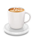 Smart Automatic Mug Warmer With Gravity Induction For Coffee And Tea keeps a steaming coffee mug on a flat base.