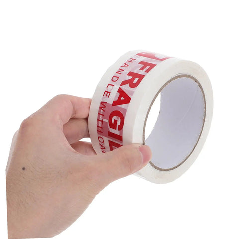 Hand holding Fragile Warning Packing Tape Set with 5 Rolls, Heavy Duty Shipping Tape That Sticks Like Crazy, Bright Handle With Care Labels