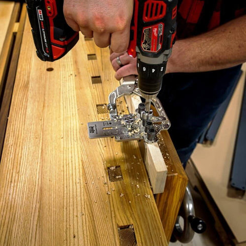 Weekend Hobbyist Stainless Dowelling Jig Kit With One Quarter Inch, Three Eighth Inch, And One Half Inch Holes in use on wooden workbench