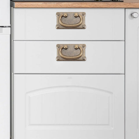 Four Pack Vintage Drawer Pull Handles For Cabinets, Dressers, Wardrobes, And Vanities shown on white kitchen drawer