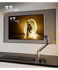 Fully Adjustable Single Monitor Mount For Desk Featuring Mechanical Spring Arm With Super Smooth Tilt And Rock Solid Bracket Design Supporting 17 To 32 Inch Screens Up To Twenty Pounds Easy Install showing a 32 inch monitor at an optimal angle.