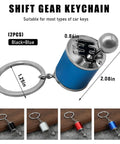 Hella Dope Two Pack Gearbox Keychain Featuring Six Speed Manual Shifter Shape With Transmission Stick Keyring in blue and black.
