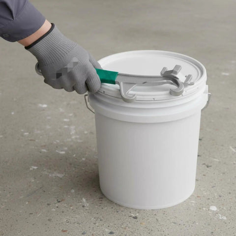 Heavy Duty Tough As Nails Multi Function Paint Pail Opener Alloy Drum Wrench With Chunky Non Slip Handle Opens Stuck Lids in use on a paint bucket.