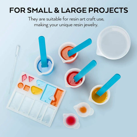 Silicone Resin Measuring Cup Tool Kit With 250 Ml And 100 Ml Cups, sticks, pipettes, and molds for epoxy resin mixing.