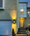 2 Pack Crystal LED Wall Lights with Frosted Matte Shade illuminating a modern home entrance at dusk.