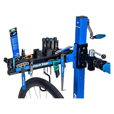 Deluxe Tool And Work Tray For Repair Stands PRS TT 2 mounted, showing tools and bike wheel for maintenance.