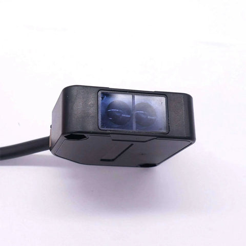 Indoor Wall Mounted Photoelectric Beam Sensor With Dual Voltage 12 To 240 VDC And 24 To 240 VAC, close-up view of sensor housing.