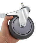 Heavy Duty Swivel Caster Wheels 2 Pack Locking Castors in hand, TPR material, gray wheel, steel stem assembly.