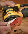 Using Random Orbit Sander With Variable Speed 5 Inch 3 Amp Corded Electric Low Vibration Design on wooden surface