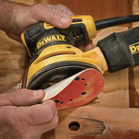 Using Random Orbit Sander With Variable Speed 5 Inch 3 Amp Corded Electric Low Vibration Design on wooden surface