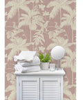 Kicked Up Your Walls With This Dope Tropical Exotic Vinyl Wallpaper Featuring A Solid Leather Texture and Heavy Duty Commercial Grade Durability Custom Printed Just For You. Soft pink backdrop with palm leaves and towels.