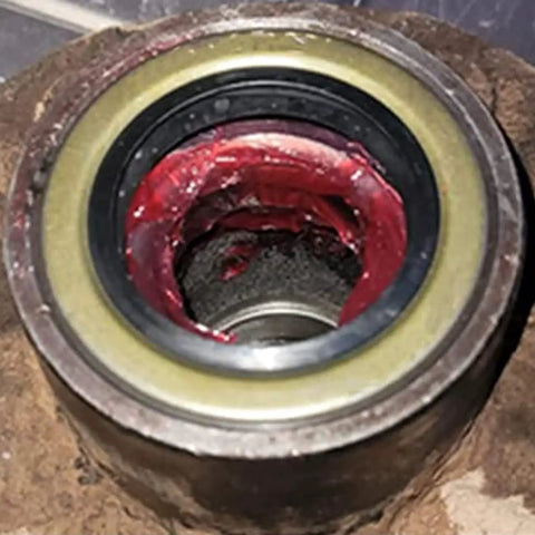 Close-up of a 4 Pack RV And Trailer Axle Grease Seals 1.719 Inch ID 2.565 Inch OD Double Lip Rubber Steel Hub Seals for 3500 lb EZ Lube Axles.