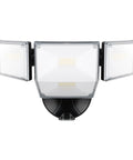 85W LED Flood Lamp Sheds 10000 Lumens Of Real Juice With Four Pivot Heads And Dusk To Dawn Switch mounted on a wall.