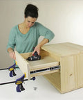 A woman installing Built Tough 12 Inch Side Mount Drawer Slides One Pair Full Extension Ball Bearing Cabinet Glides Auto Lock.