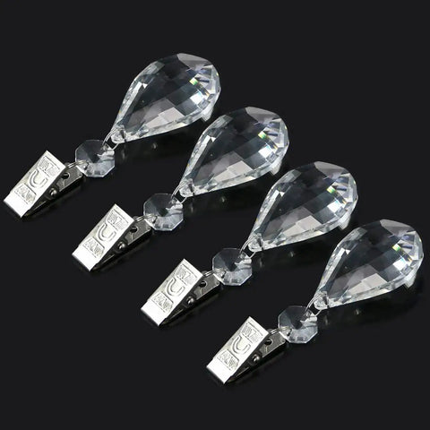 Four marquise crystal teardrops with stainless clips, part of Marquise Crystal Teardrop Tablecloth Weights With 10 Piece Stainless Clip Kit.