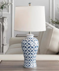 Blue Ceramic Table Lamp With White Fabric Shade Chinoiserie Urn Style Hand Painted Detail Brings Cozy Coastal Vibe