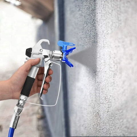 Top Tier Airless Spray Gun Compatible With Graco Paint Sprayers Featuring 517 Tip Nozzle Guard 3600 Psi Rating And Smooth As Butter Four Finger Trigger Ace Applicator spraying paint on a wall.