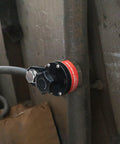 Magnetic Welding Ground Clamp with On Off Switch 40 Kg Pull 300 Amp Rated attached to a metal pipe for welding use.