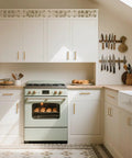 10 Pack Antique Brass Cabinet Pulls Square Design With Five Inch Center To Center About Five And Two Fifths Inches Long Solid Zinc Alloy Kitchen Cabinet Handles Polished Gold Drawer Pulls Hardware on white kitchen cabinets above a vintage-style oven.