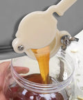 Food Grade Plastic Honey Gate Valve Set For 5 Gallon Buckets pouring honey into jar