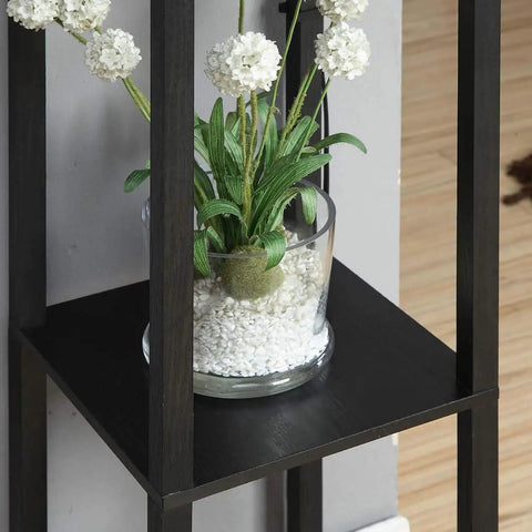 Shelf detail of Dope Tower Floor Lamp With Shelves And USB Ports, featuring a potted plant on black wood grain surface.